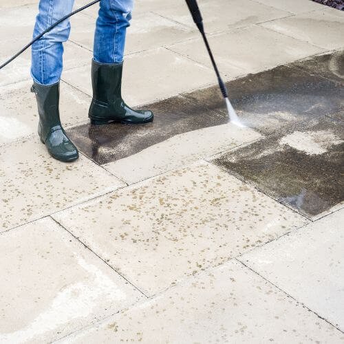 Pressure Washing Expert Cleaning a Paved Residential Patio