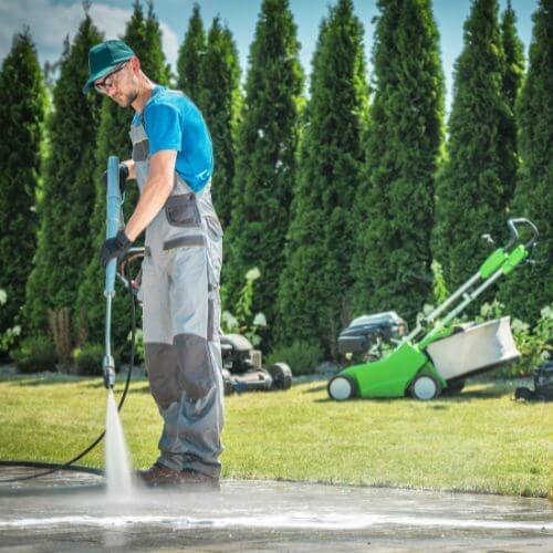 Professional Pressure Washer Cleaning Garden Paths and Driveway