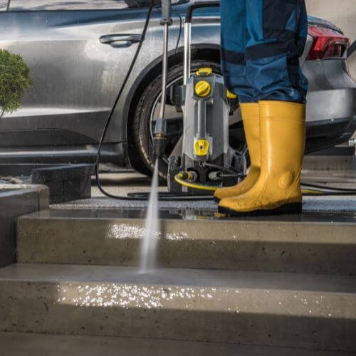 A Professional Cleaning a Driveway