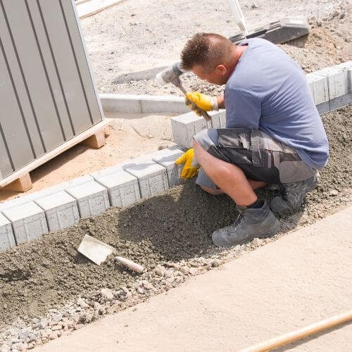 A Professional Working on Pavers - Best Paver Sealing Company in Florida